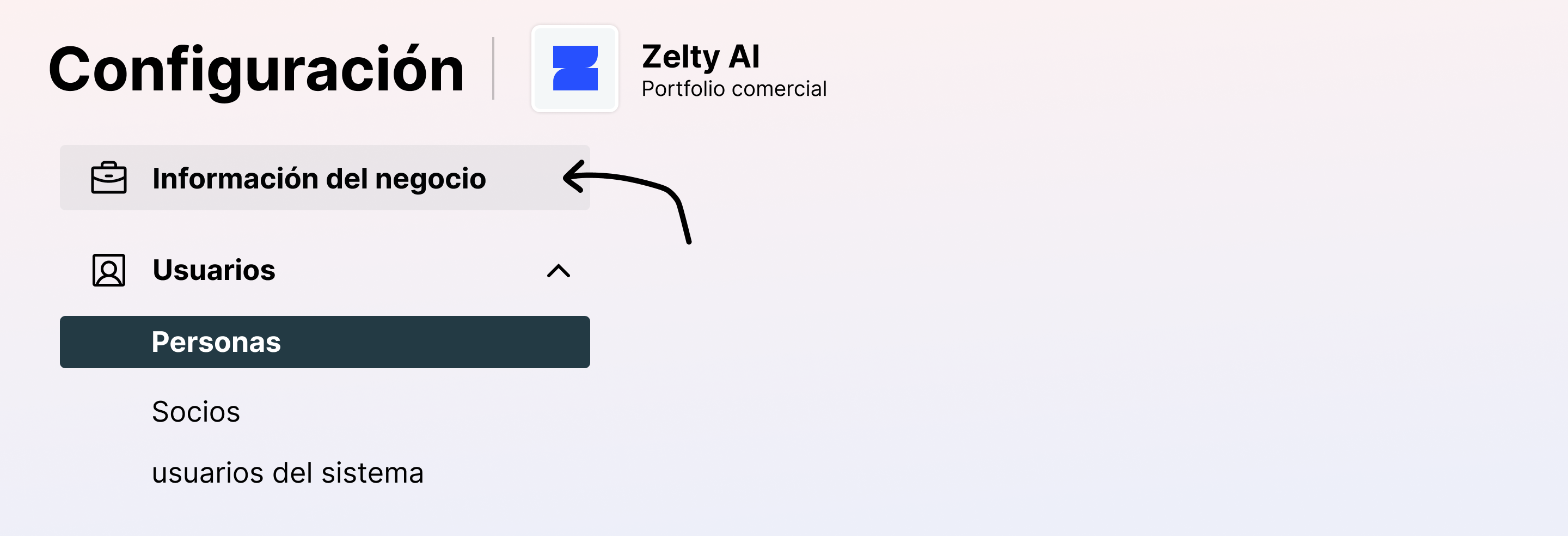 Menú de configuración de Meta Business Suite con una flecha señalando la sección "Información del negocio" dentro del portafolio comercial de Zelty AI.